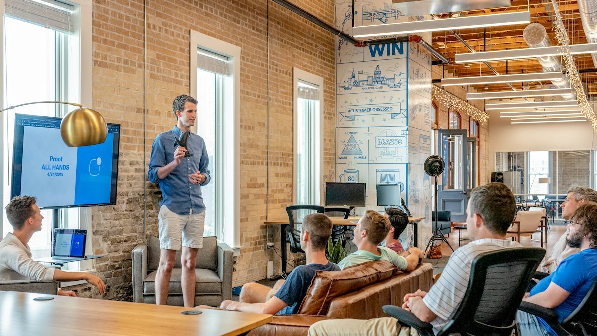 A team planning session with a presenter at the front of the room